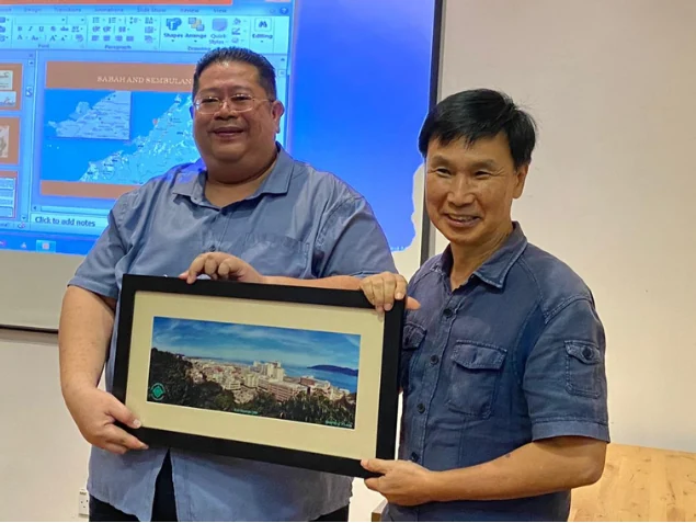 Presentation of a framed photograph following the talk