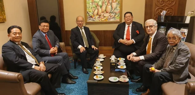 Meeting participants seated together