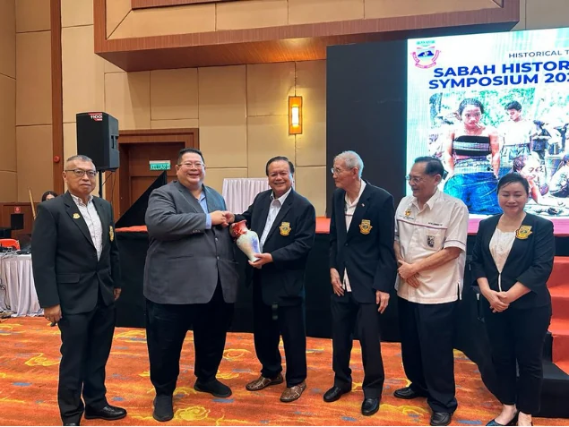 Presentation of a certificate at the Sabah History Symposium
