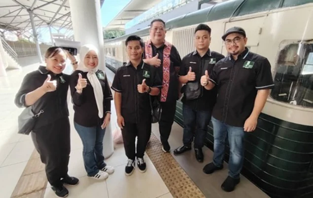 Participants beside the train at Tanjung Aru Railway Station
