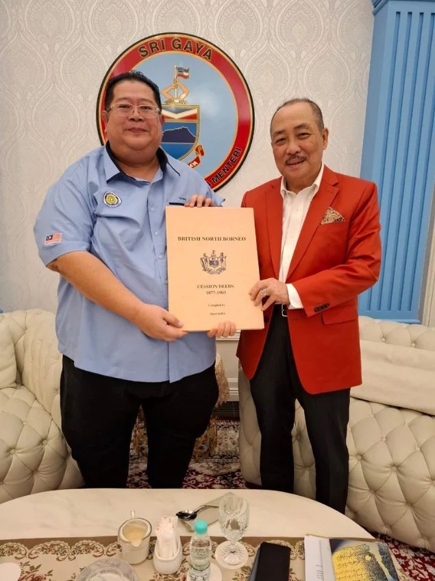 Shari Jeffri presenting the manuscript to the Chief Minister of Sabah