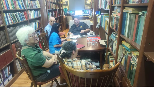 Visitors meeting around a table