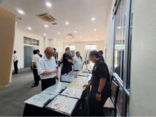 Visitors browsing historical records at the exhibition