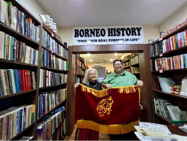 Shari Jeffri and Dr. Bianca Gerlich holding a red banner