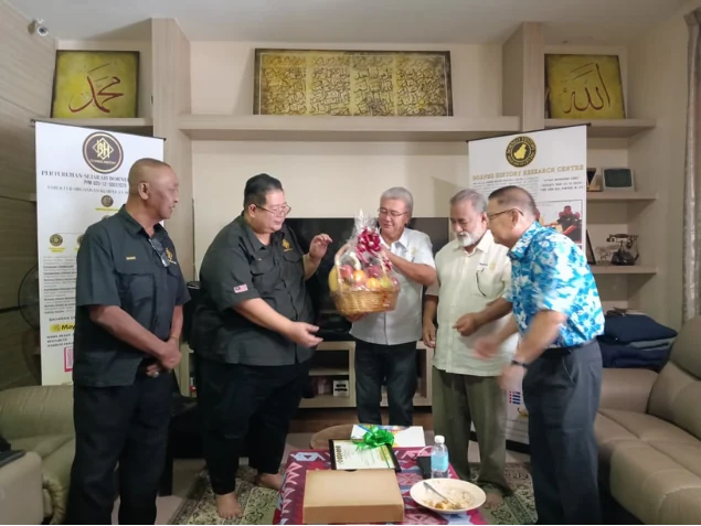 A gift presentation during the Rotary Club visit